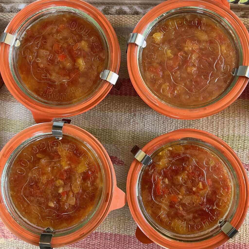 Canning-with-Weck-jars - 16 Jars of salsa cooling after processing.