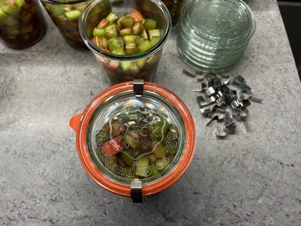 Canning-with-Weck-jars - 9 jar of rhubarb chunks with the lid and seal clamped down