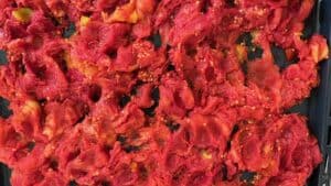 Tomato pulp on a baking sheet, thick from roasting in the oven