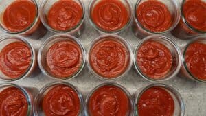 Red pepper and tomato soup in canning jars getting ready for water bath processing