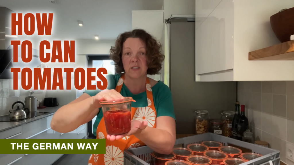 Checking the seal on a WECK jar of home-canned tomatoes, lifted by its glass lid